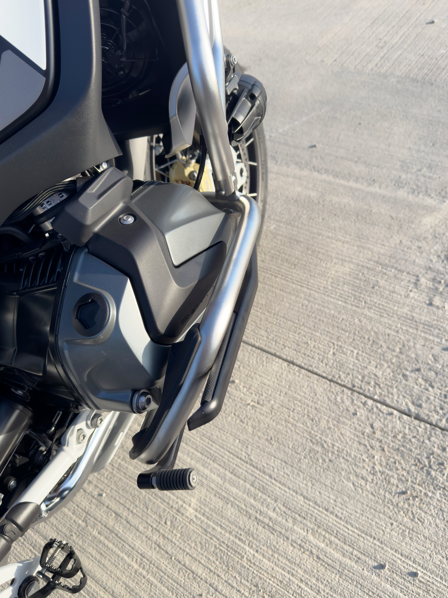 Comfortable BMW motorcycle highway pegs. BMW R1250 GSA highway peg foot rest.